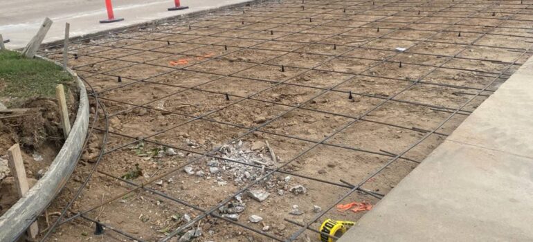 Can an Asphalt Contractor Pave Over a Concrete Parking Lot?